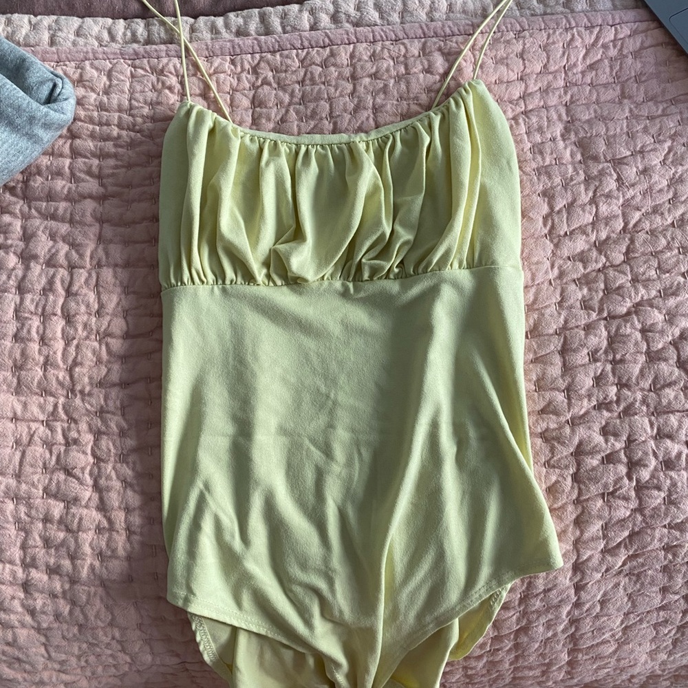 Yellow bodysuit